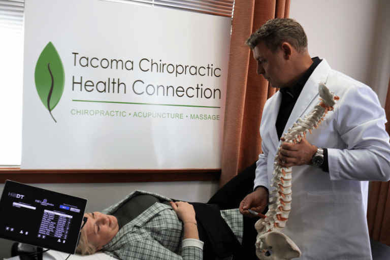 Dr. Brad with patient at Tacoma Chiropractic Health Connection in Tacoma
