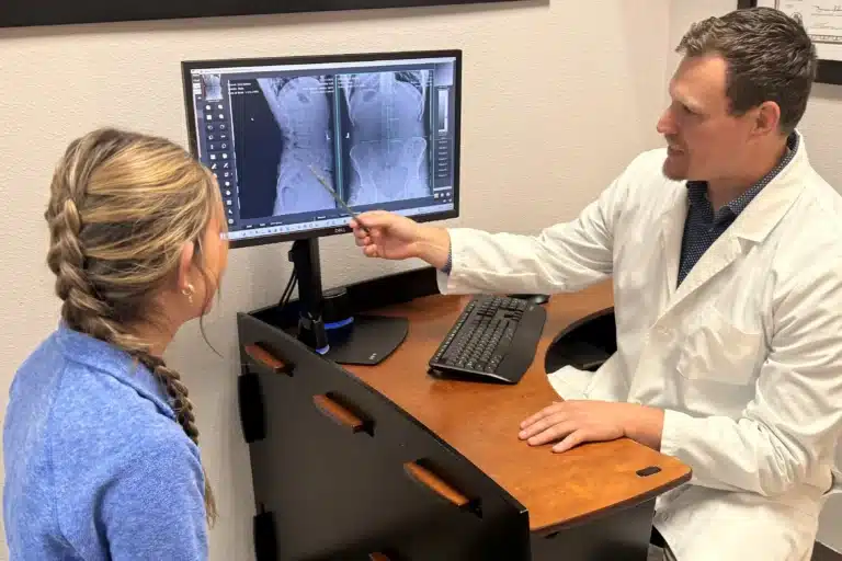 Chiropractor discussing diagnostic images with a Tacoma patient
