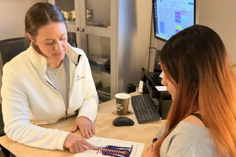 Clinic team member reviewing visit information with a patient
